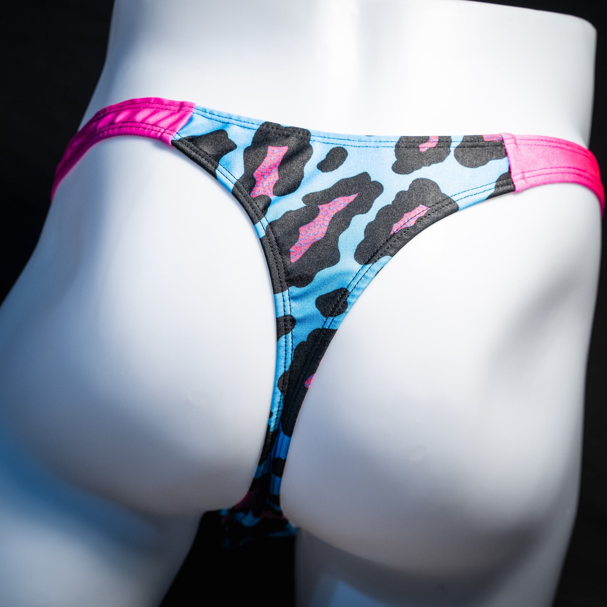 Men's blue and pint cheetah print thong underwear, full thong front, rear view.