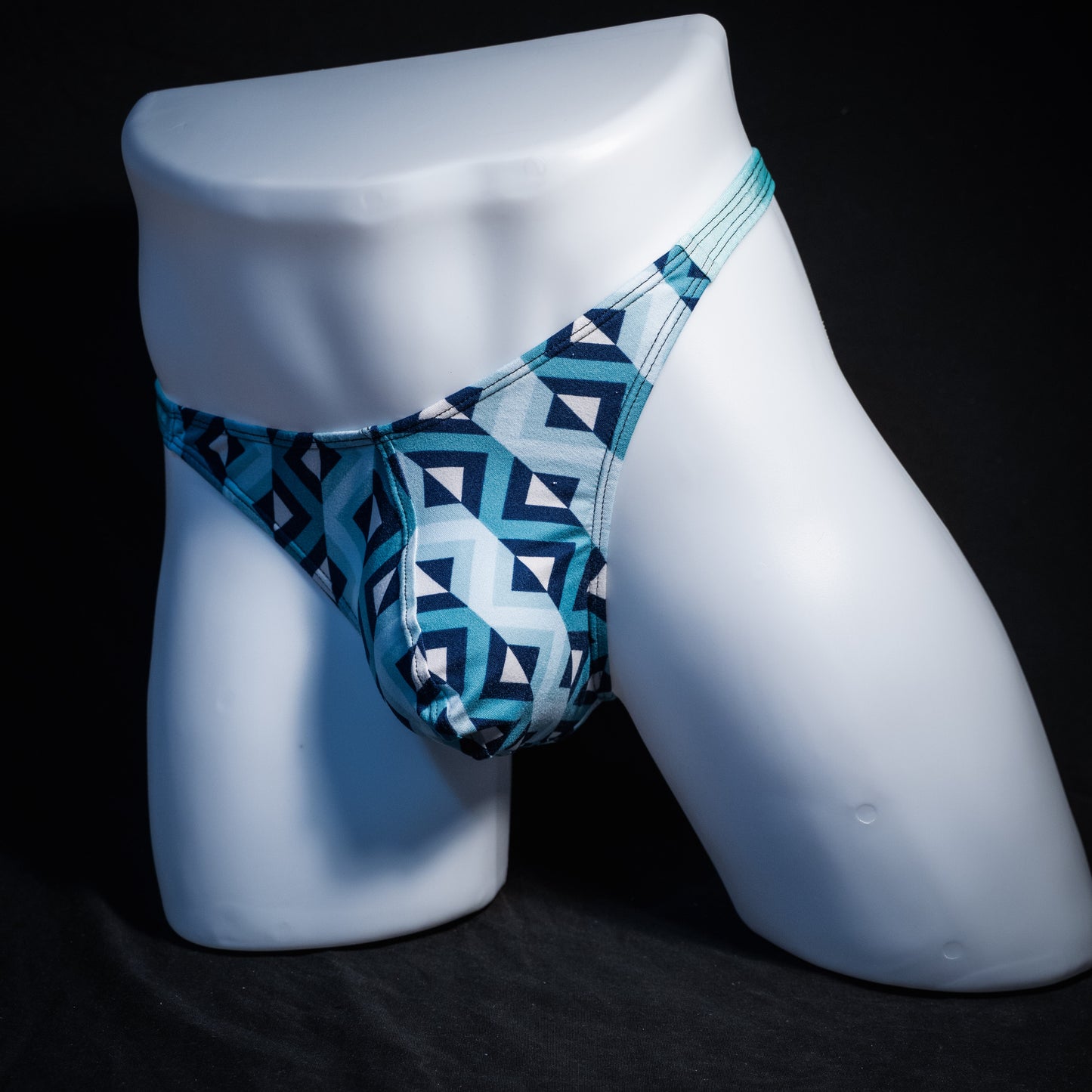 Men's blue geometric thong underwear, classic cut, front view.