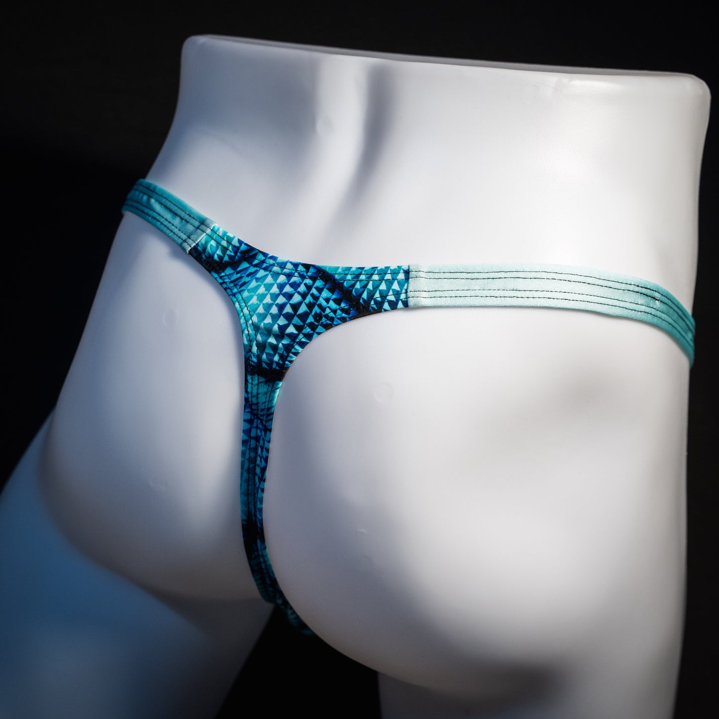 Men's blue merman thong underwear, classic cut, rear view.