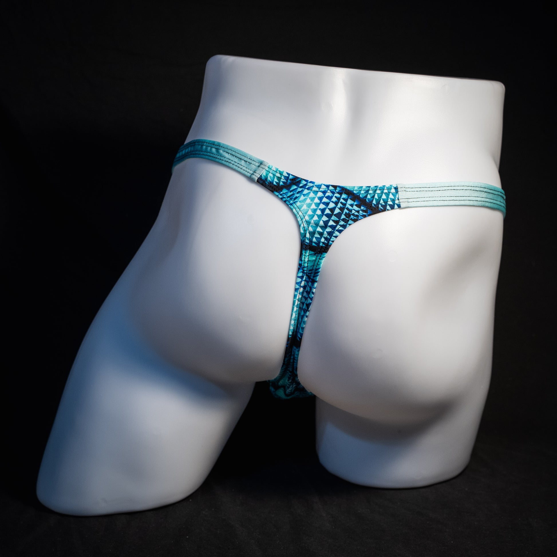 Men's blue merman thong underwear, classic cut, rear view.