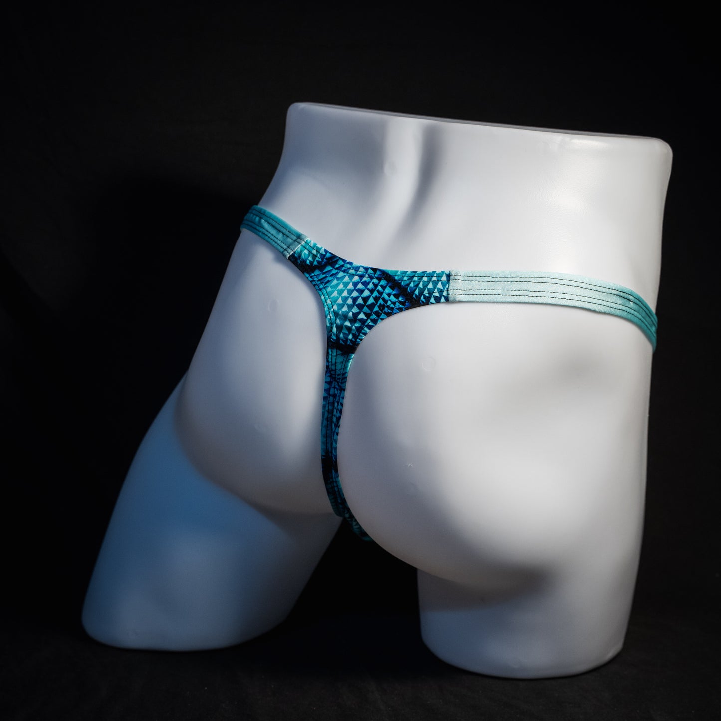 Men's blue merman thong underwear, classic cut, rear view.