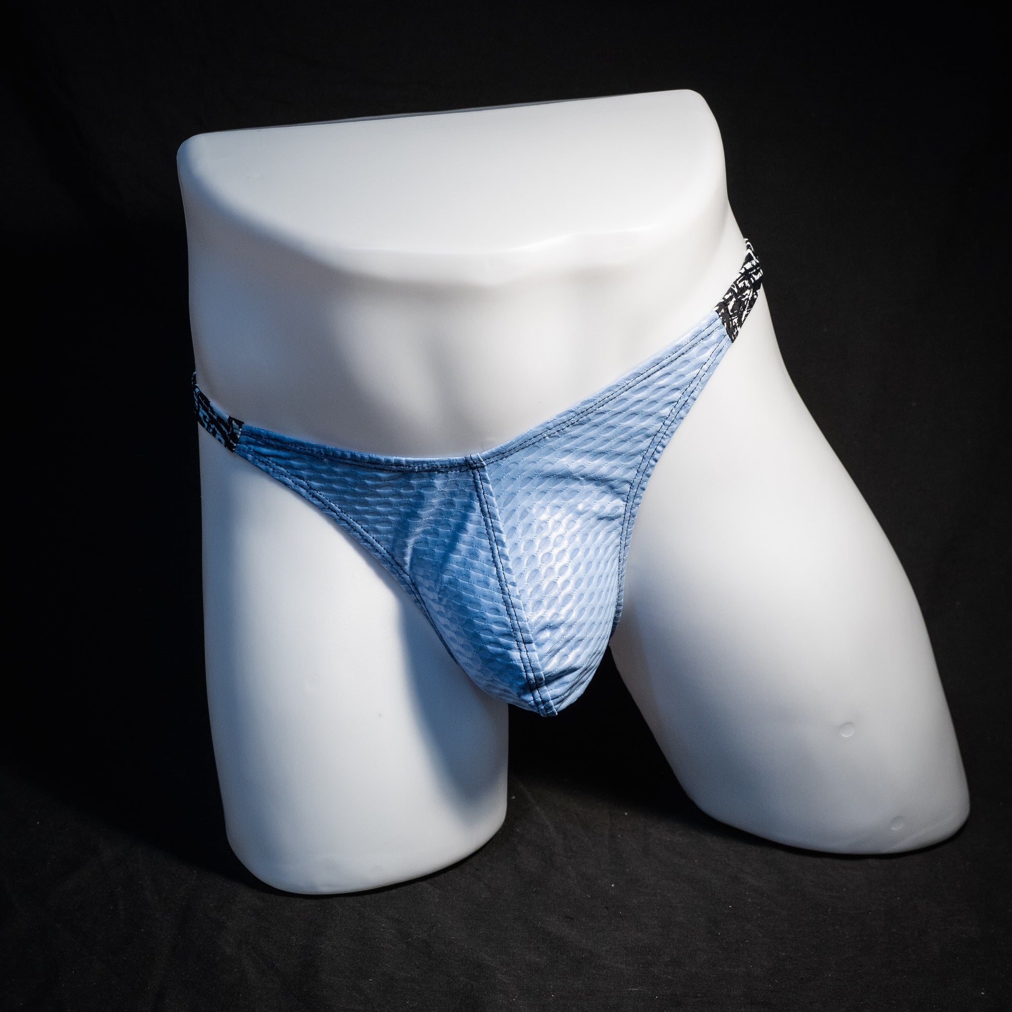 Men's blue mesh thong underwear, classic cut, front view.