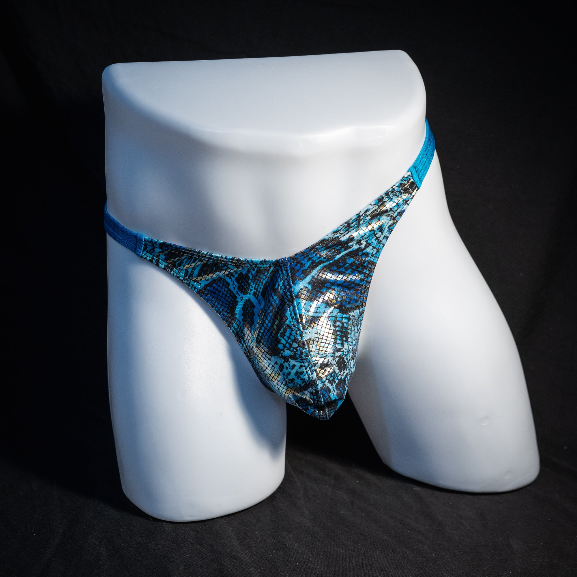 Men's blue metallic snakeskin thong underwear, classic cut, front view.