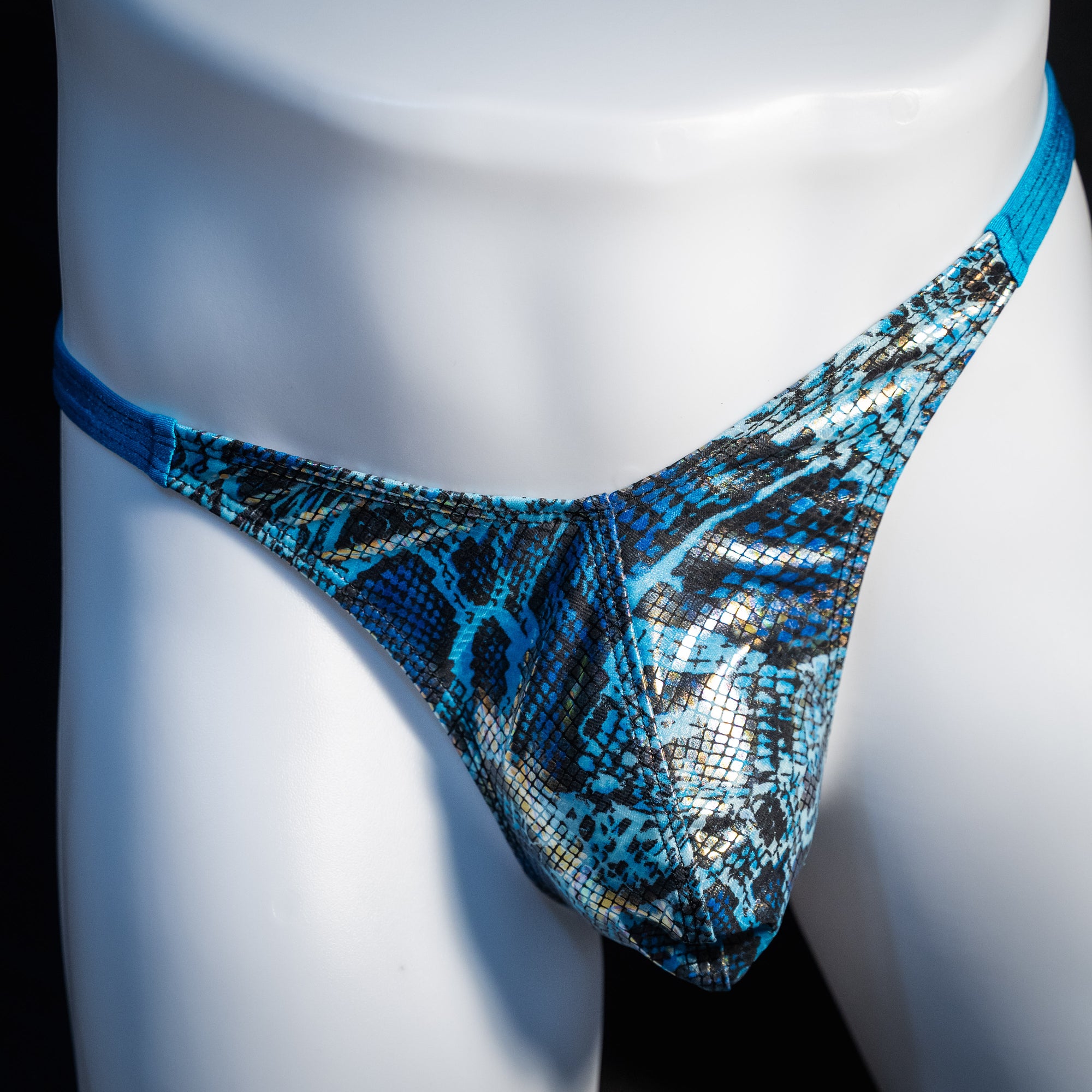 Men's blue metallic snakeskin thong underwear, classic cut, front view.