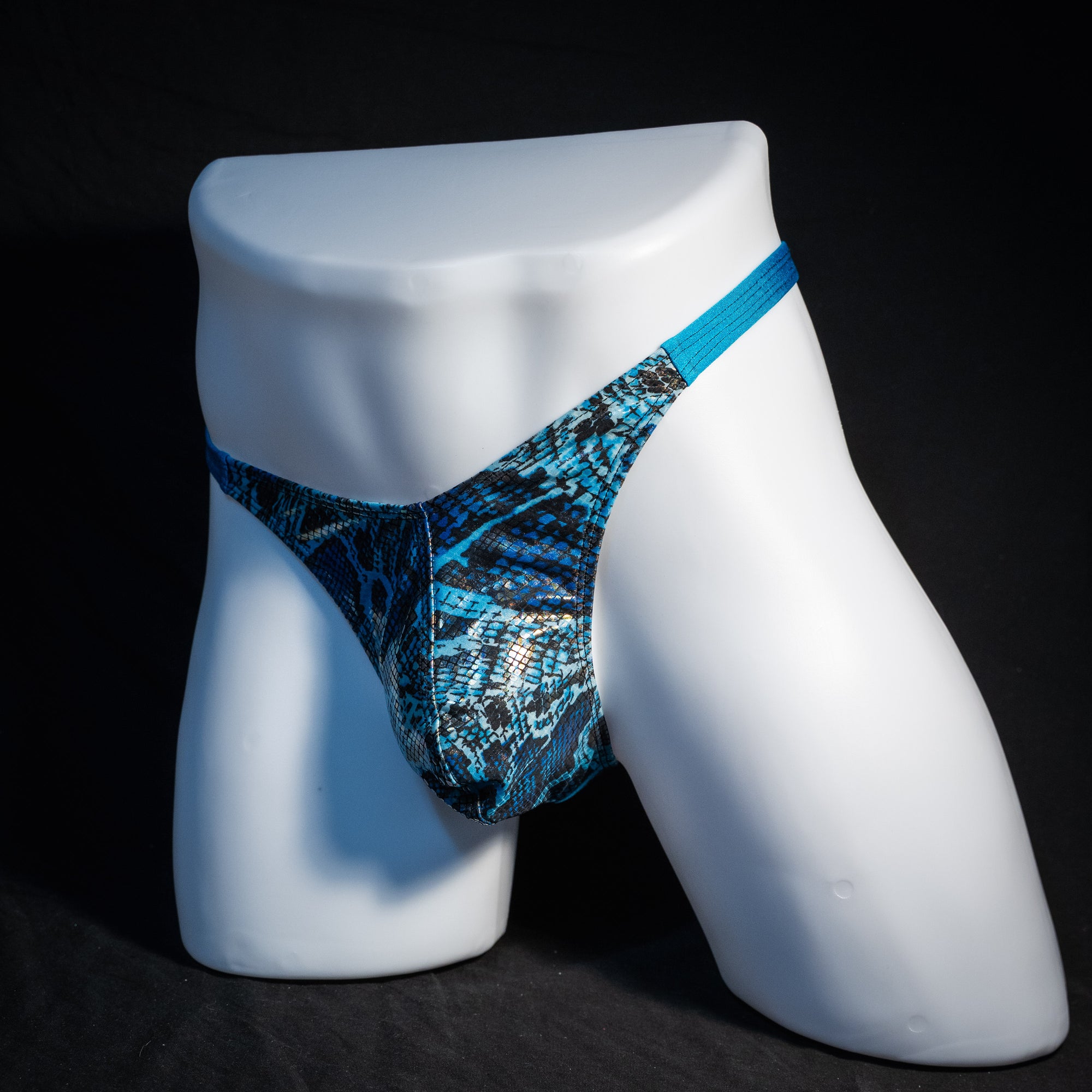 Men's blue metallic snakeskin thong underwear, classic cut, front view.