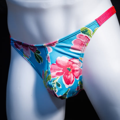 Men's blue with pink flowers thong underwear, classic cut, front view.