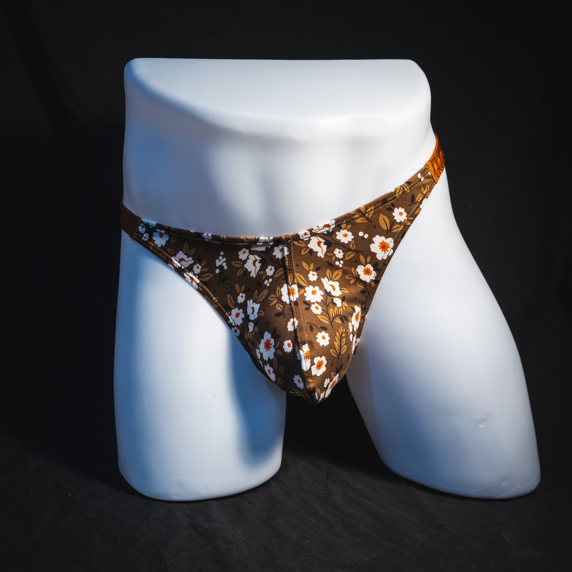 Men's brown earth tone floral thong underwear, classic cut, full front view.