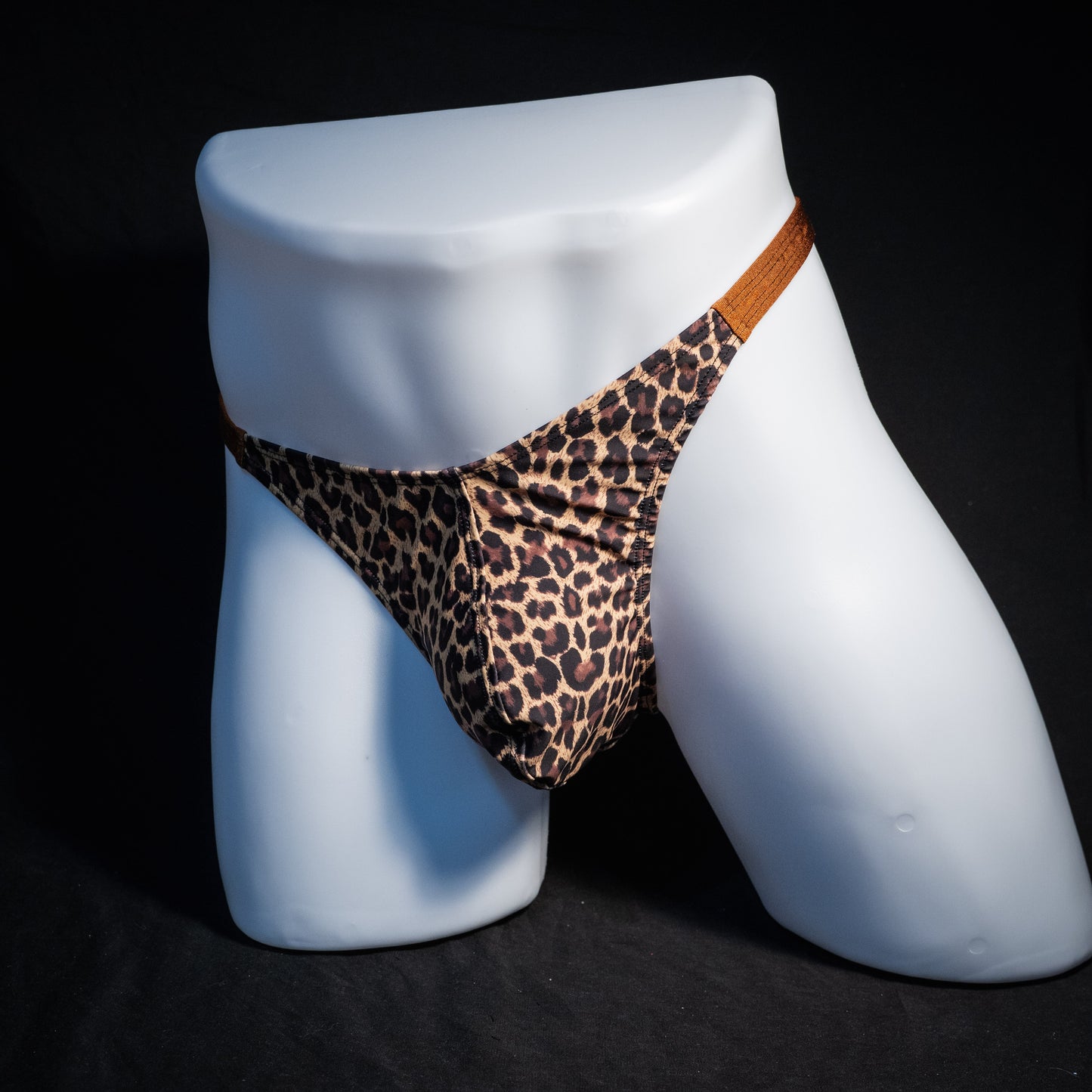Men's leopard print thong underwear, classic cut, front view.