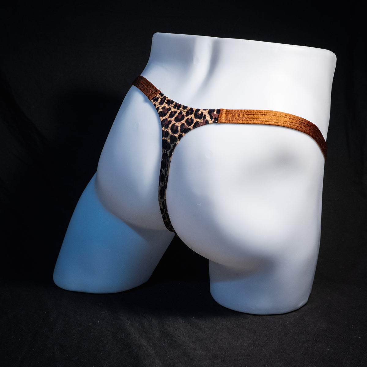 Men's leopard print thong underwear, classic cut, rear view.