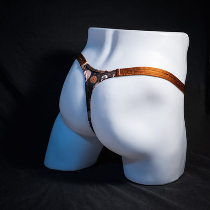 Men's brown skull patterned thong underwear, classic cut, rear view.