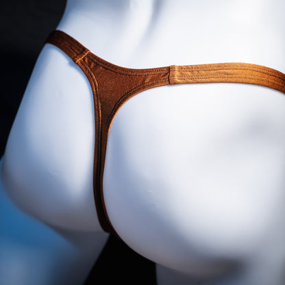 Men's solid brown spandex thong underwear, classic cut, rear view.