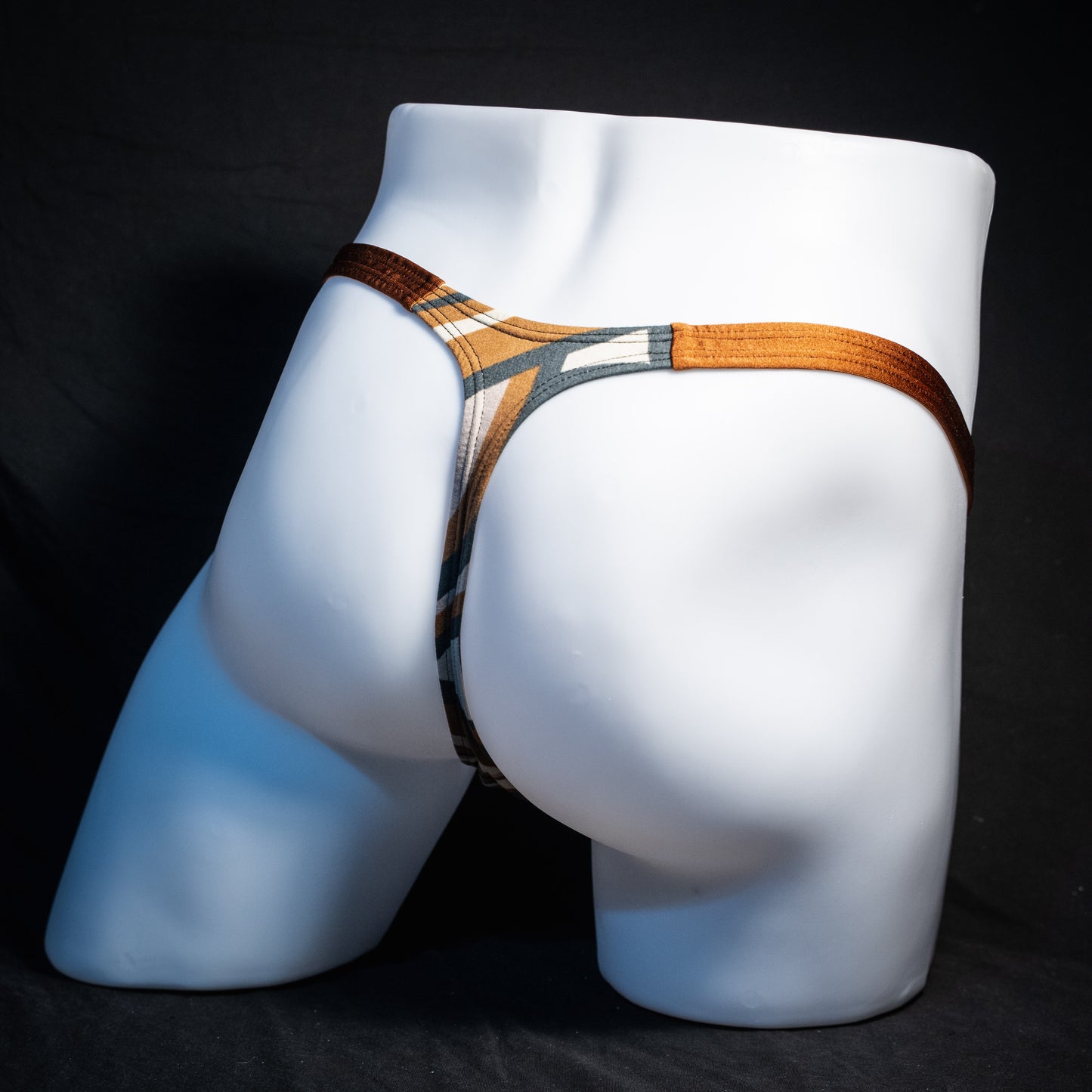 Men's brown and tan thong underwear, classic cut, rear view.