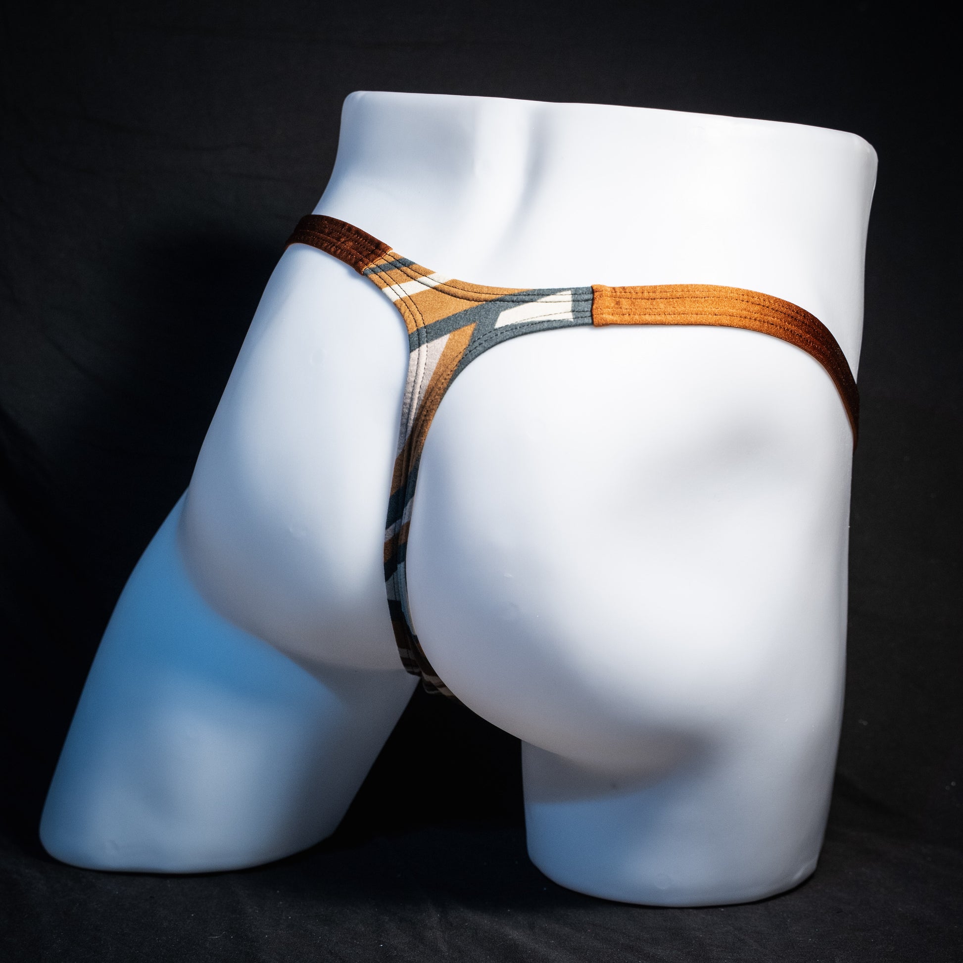 Men's brown and tan thong underwear, classic cut, rear view.