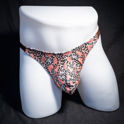 Men's cheetah print thong underwear with penises, classic cut, front view.