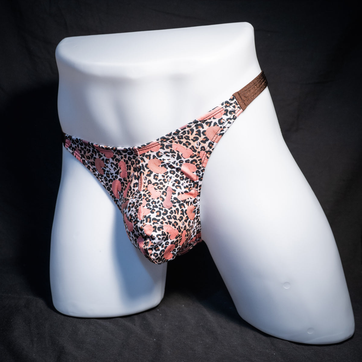 Men's cheetah print thong underwear with penises, classic cut, front view.