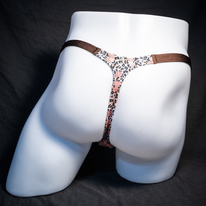 Men's cheetah print thong underwear with penises, classic cut, rear view.
