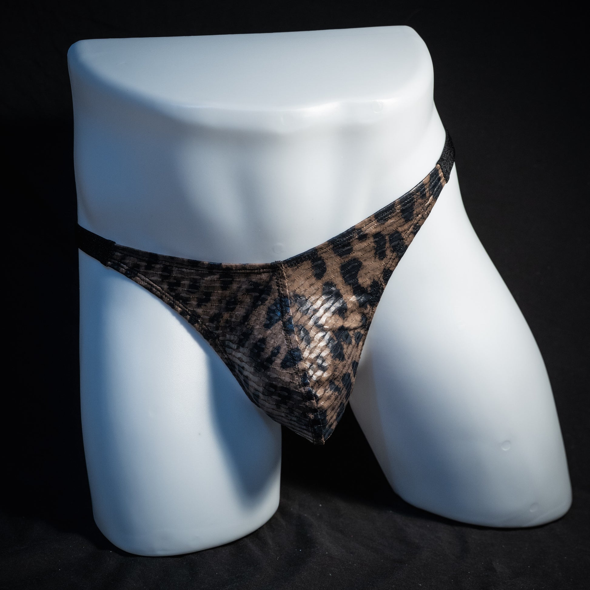Men's cheetah print mesh thong underwear, classic cut, front view.