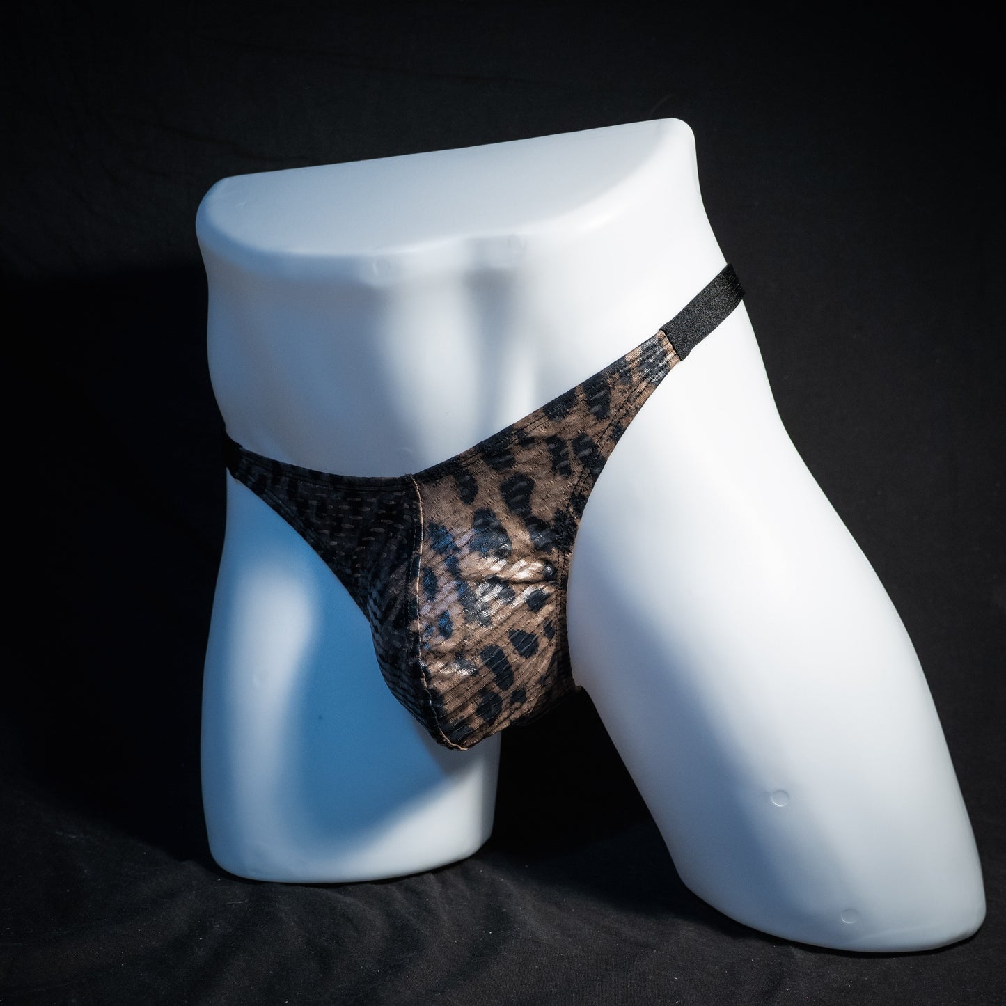 Men's cheetah print mesh thong underwear, classic cut, front view.
