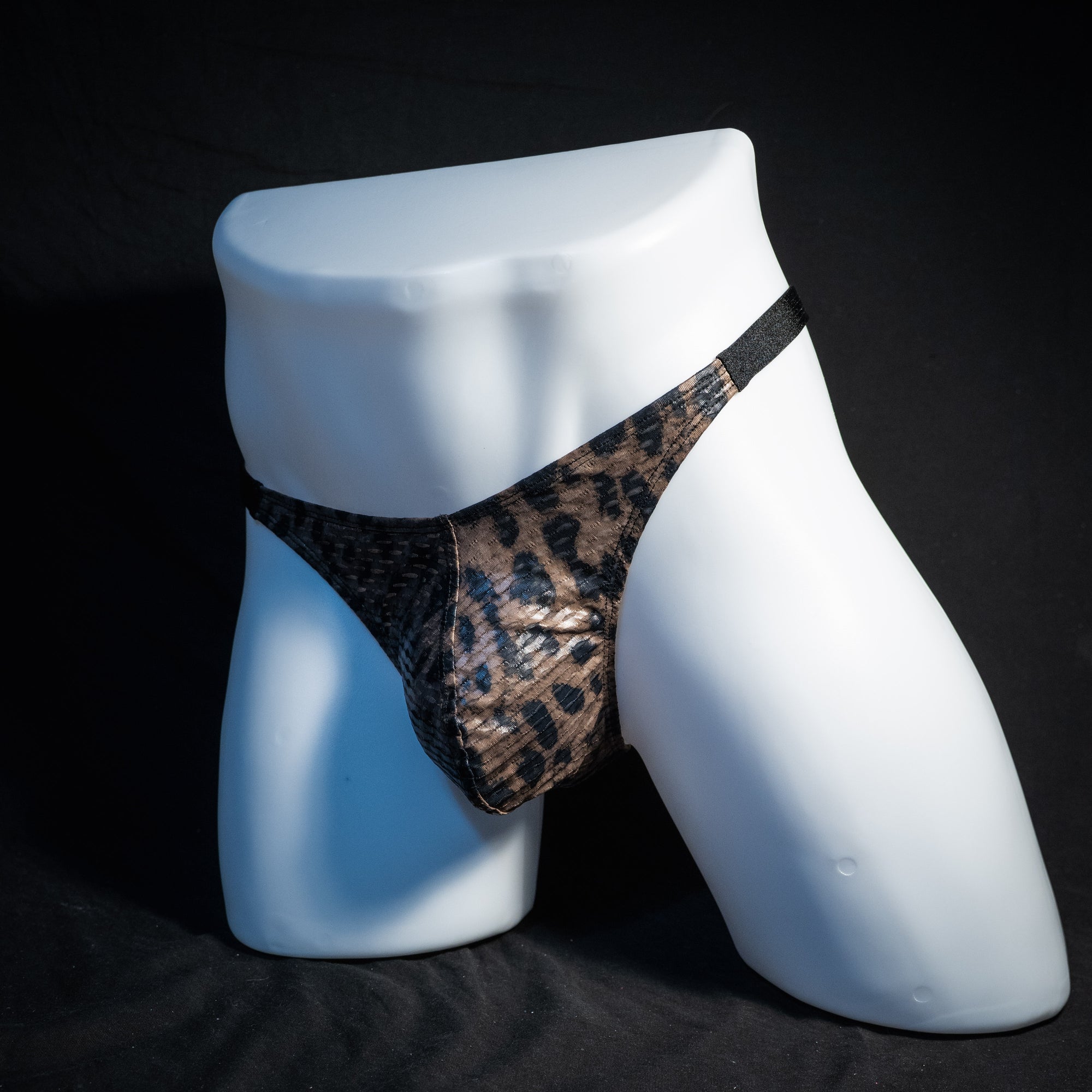 Men's cheetah print mesh thong underwear, classic cut, front view.