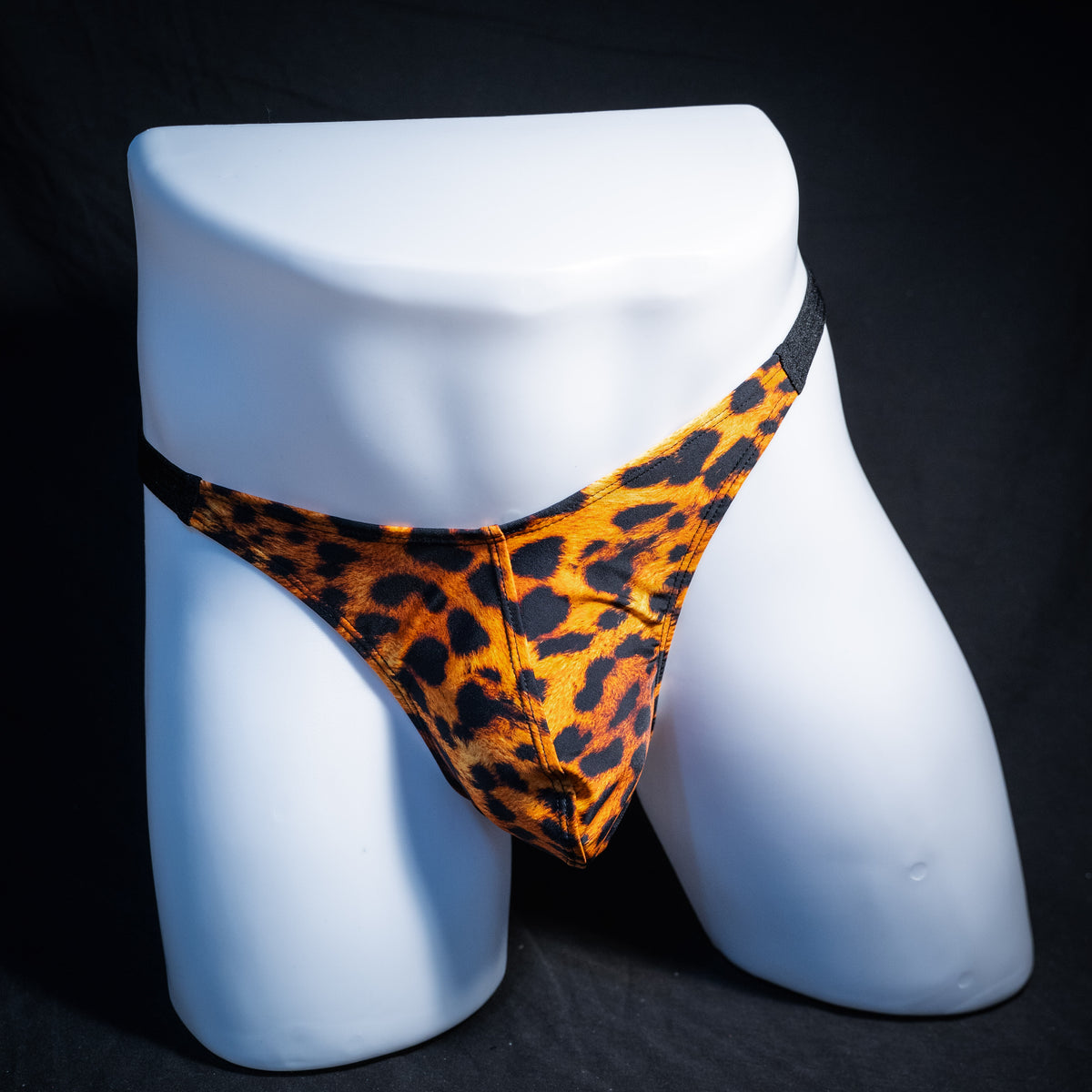 Men's cheetah print thong underwear, classic cut, front view.