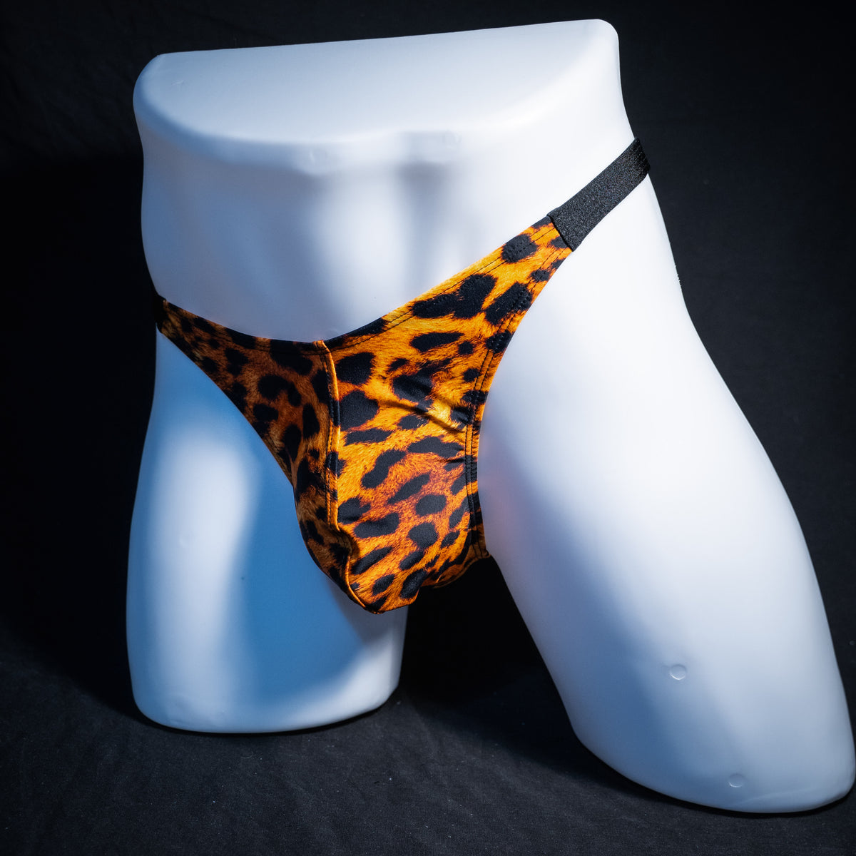 Men's cheetah print thong underwear, classic cut, front view.