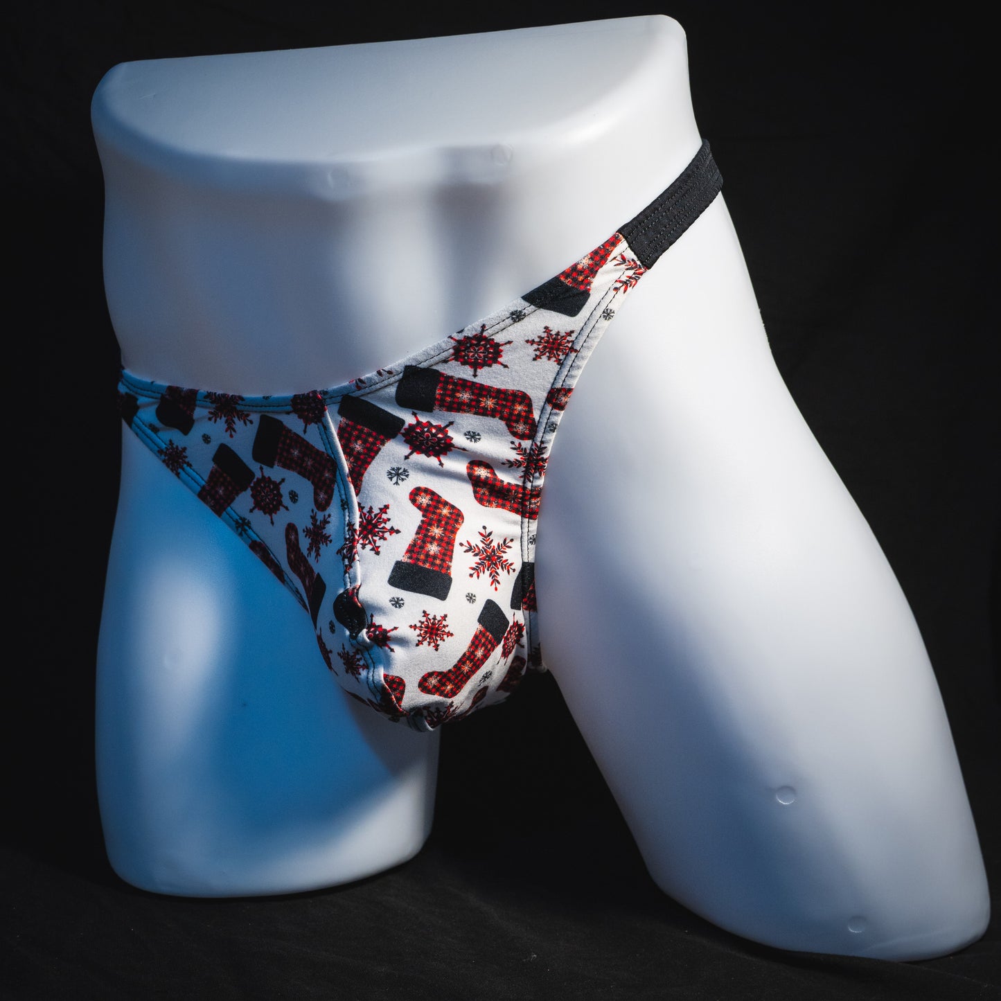Men's Christmas stockings thong underwear, classic cut, full angled front view.