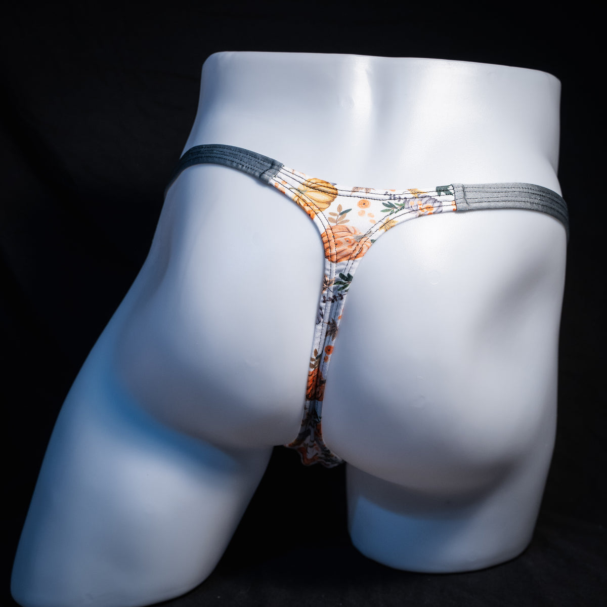 Men's autumn themed thong underwear, classic cut, rear view.