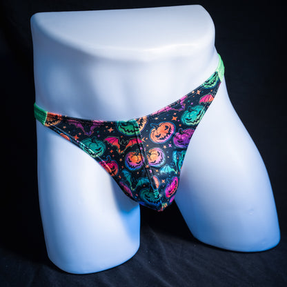 Men's colorful Jack O' Lanterns thong underwear, classic cut, front view.