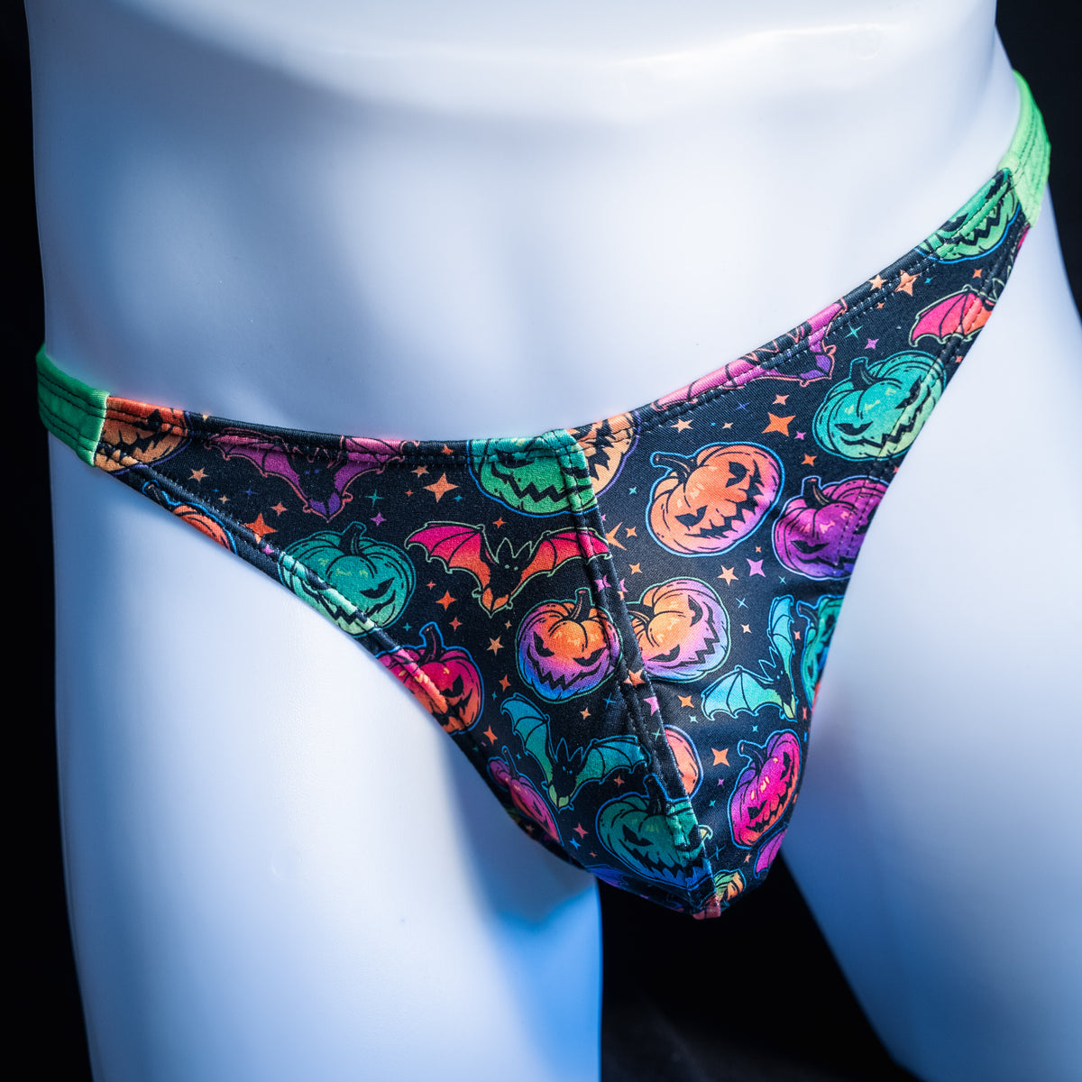 Men's colorful Jack O' Lanterns thong underwear, classic cut, front view.