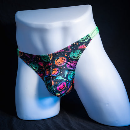 Men's colorful Jack O' Lanterns thong underwear, classic cut, front view.