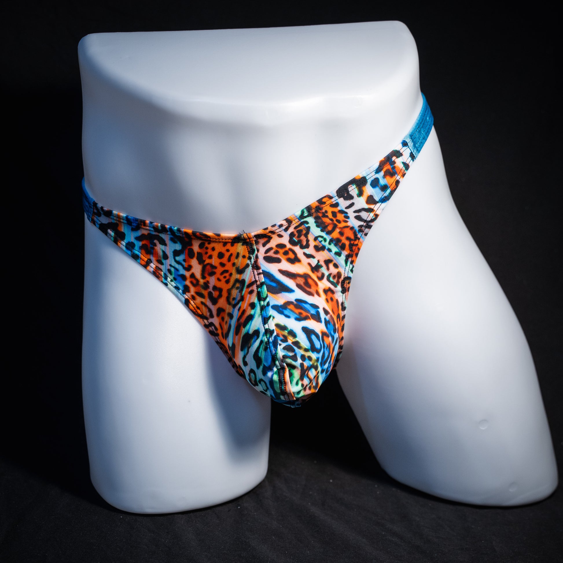 Men's colorful leopard thong underwear, classic cut, front view.