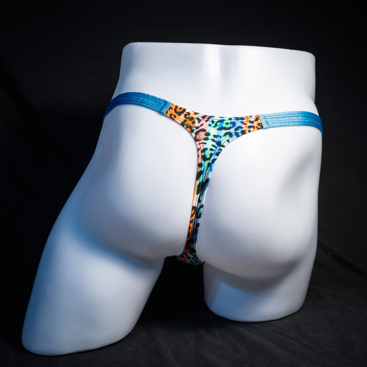 Men's colorful leopard thong underwear, classic cut, rear view.