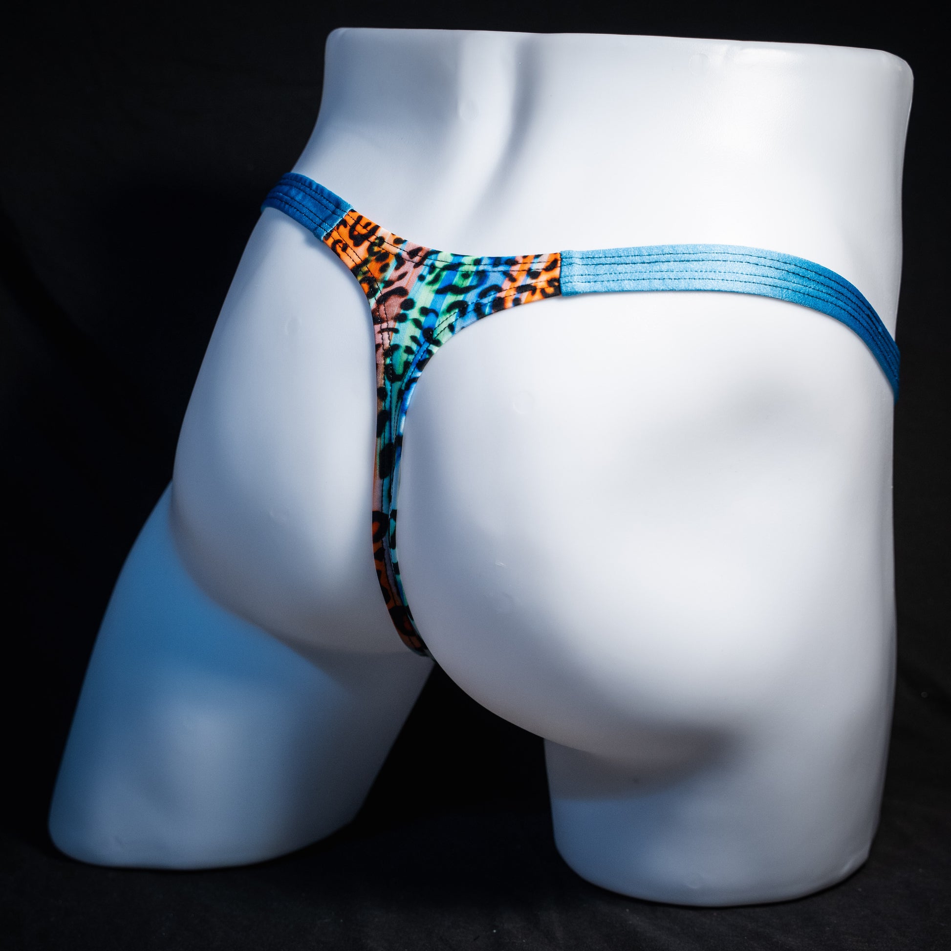 Men's colorful leopard thong underwear, classic cut, rear view.