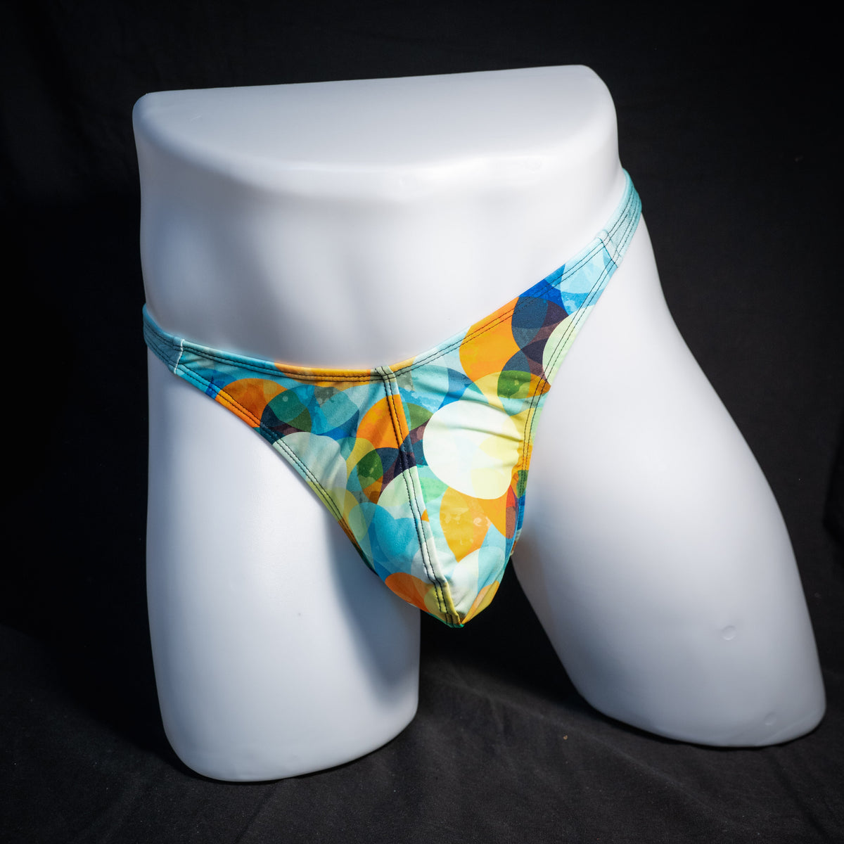 Men's colorful thong underwear, classic cut, front view.