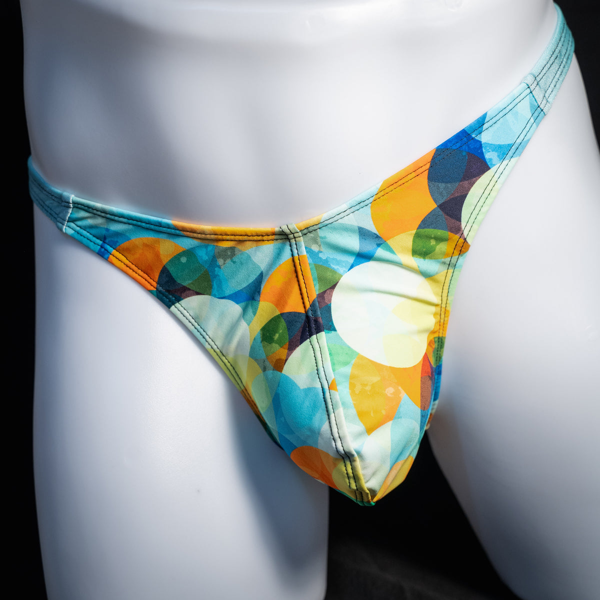 Men's colorful thong underwear, classic cut, front view.