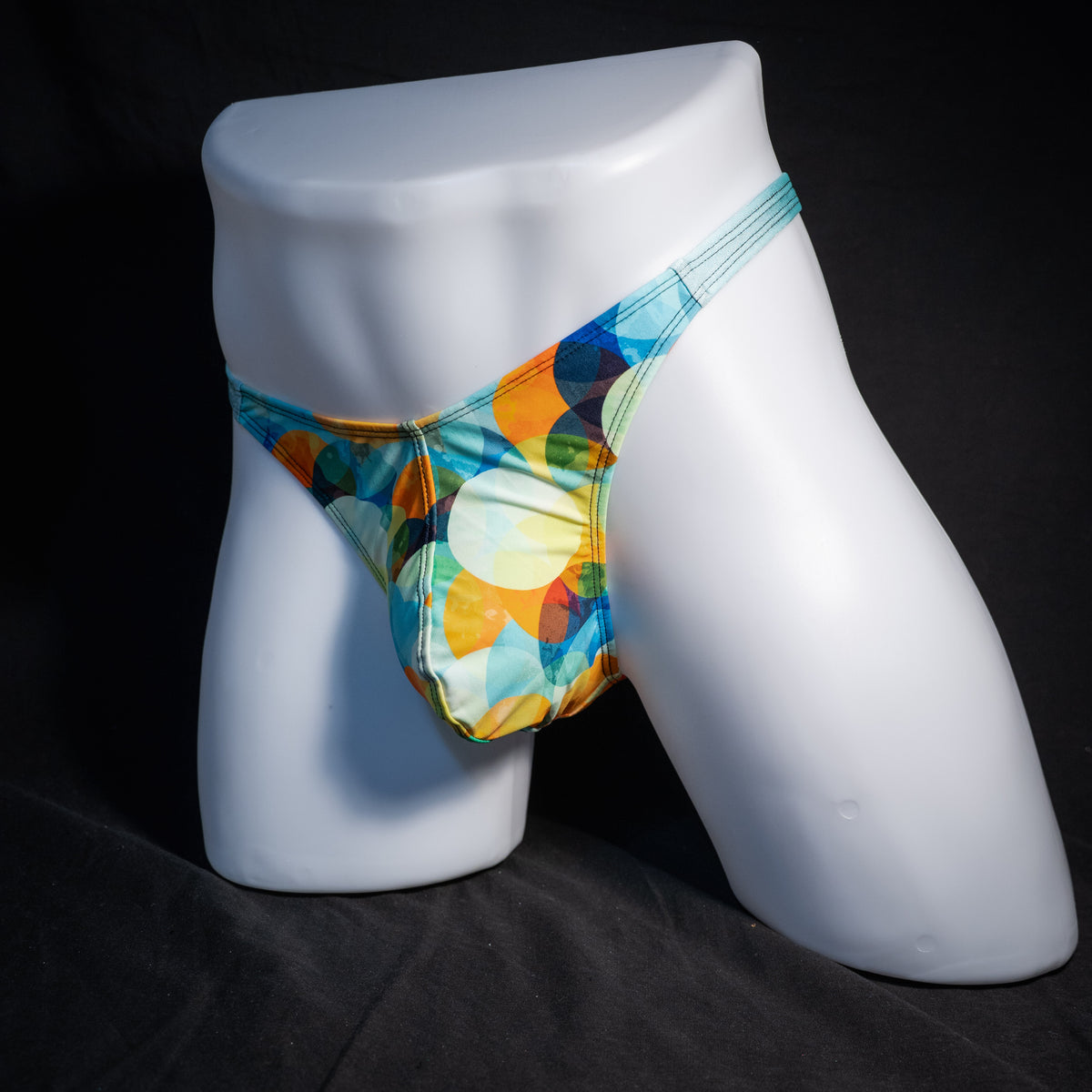 Men's colorful thong underwear, classic cut, front view.