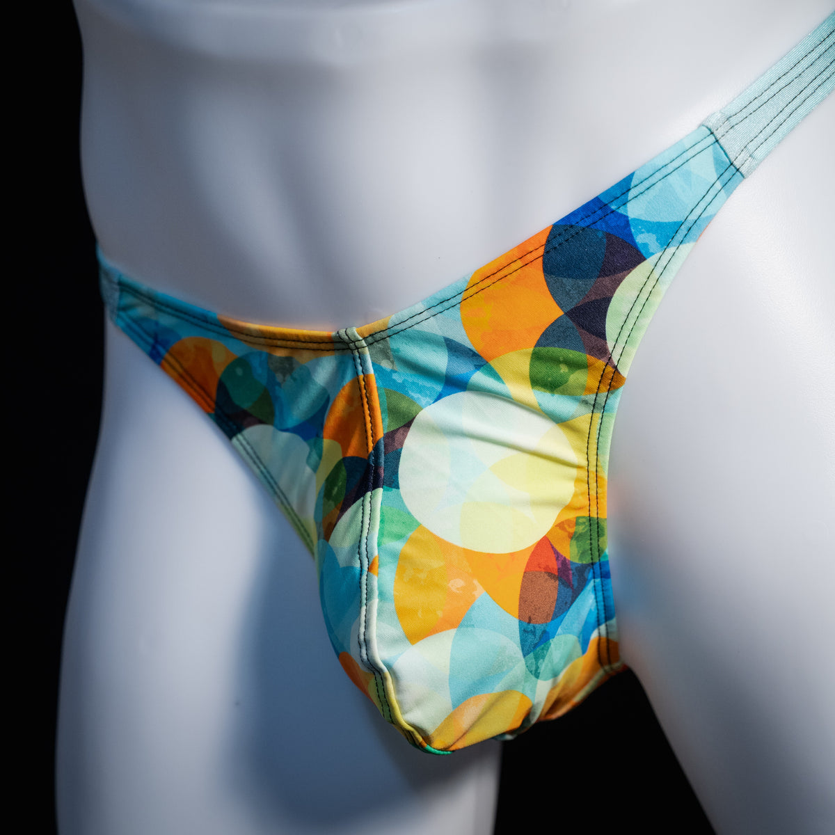 Men's colorful thong underwear, classic cut, front view.