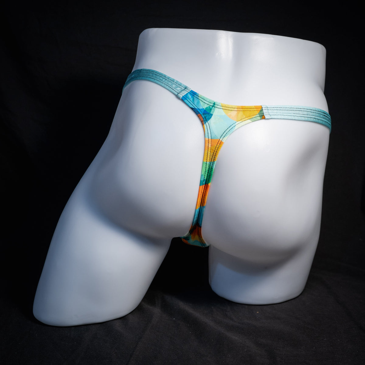 Men's colorful thong underwear, classic cut, rear view.