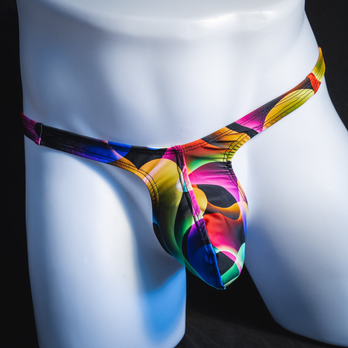 Men's colorful thong underwear, tower cut, front view.