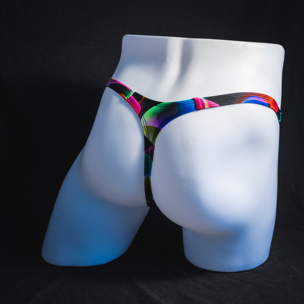 Men's colorful thong underwear, tower cut, full rear view.