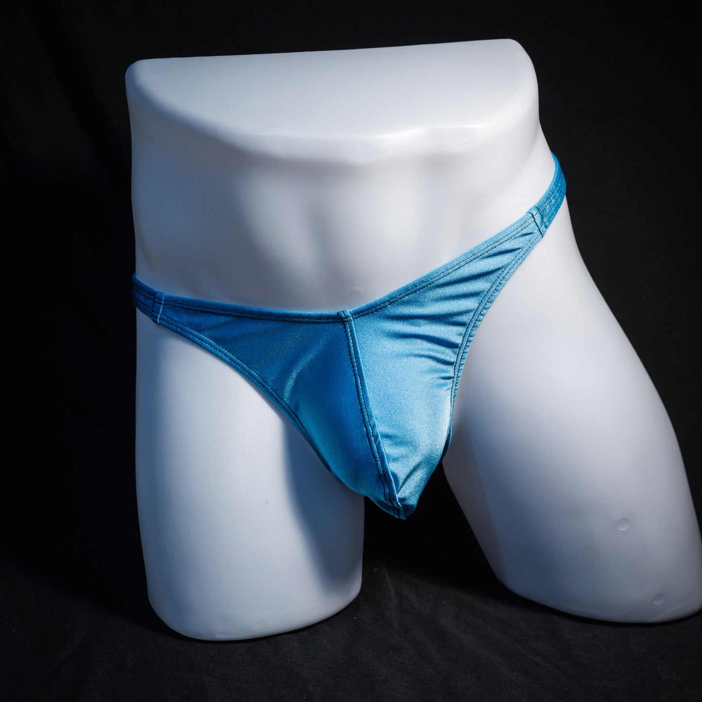 Men's columbia blue thong underwear, classic cut, front view.