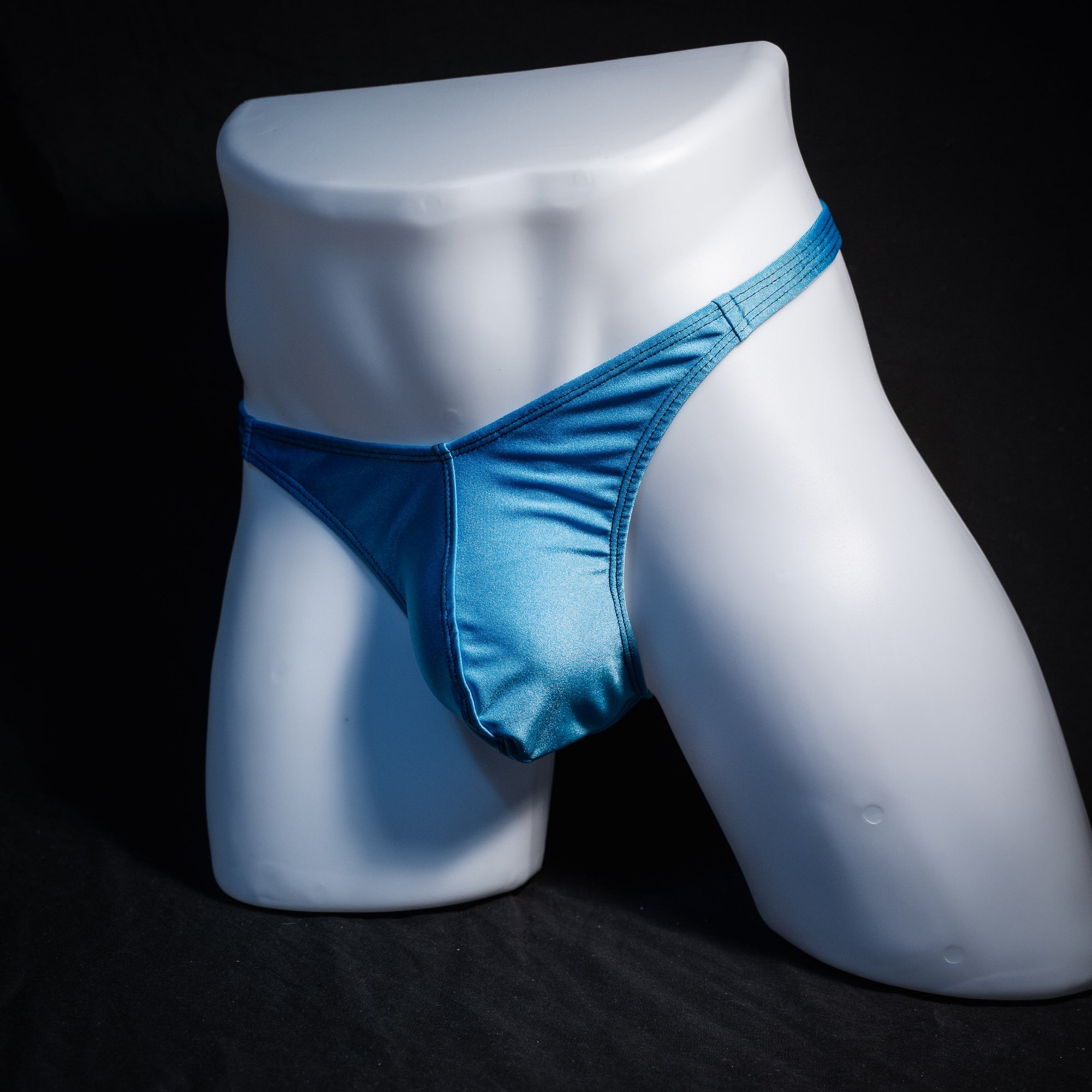 Men's columbia blue thong underwear, classic cut, front view.