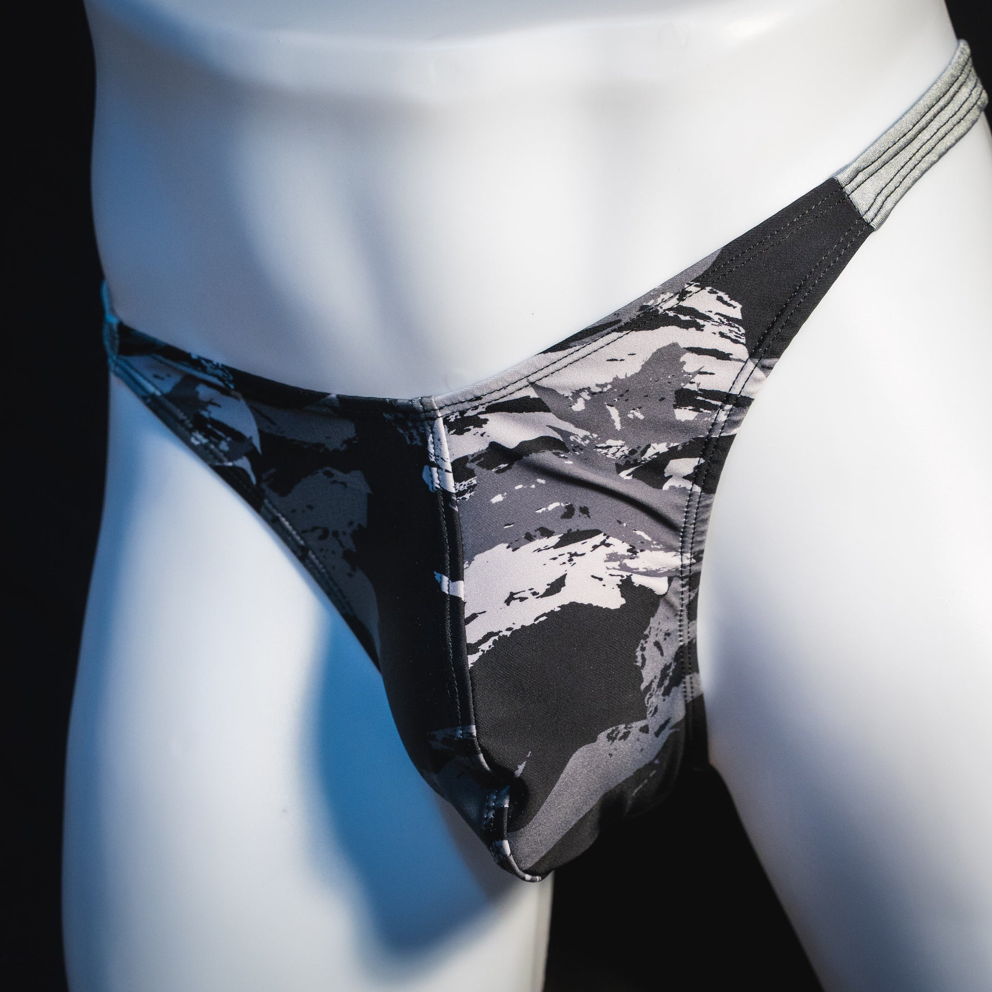Men's concrete shapes thong underwear, classic cut, angled front view.