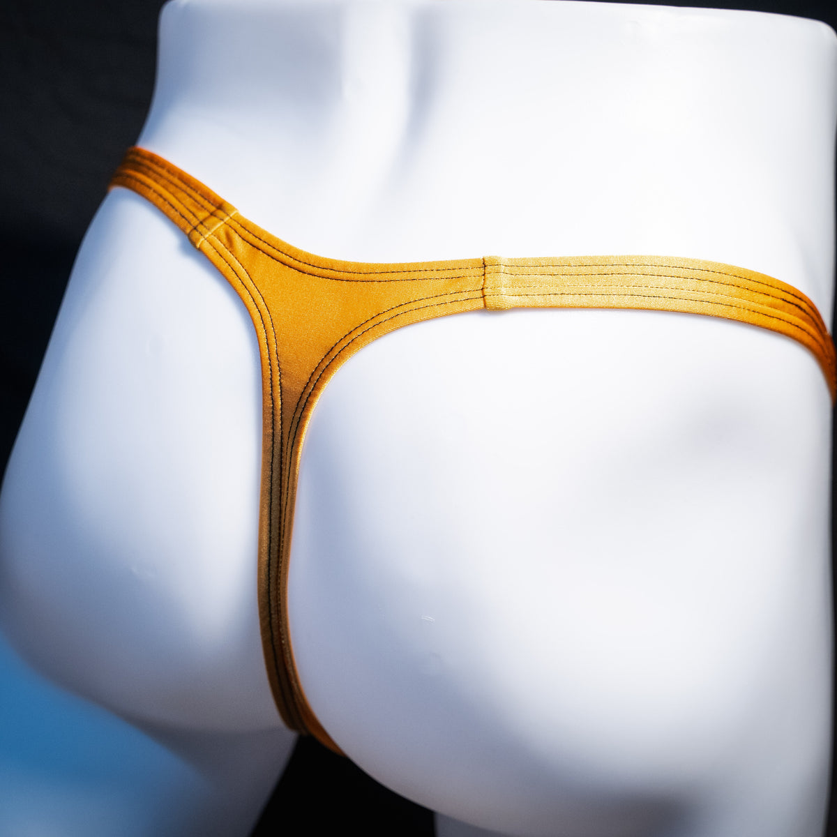 Men's copper spandex thong underwear, classic cut, rear view.