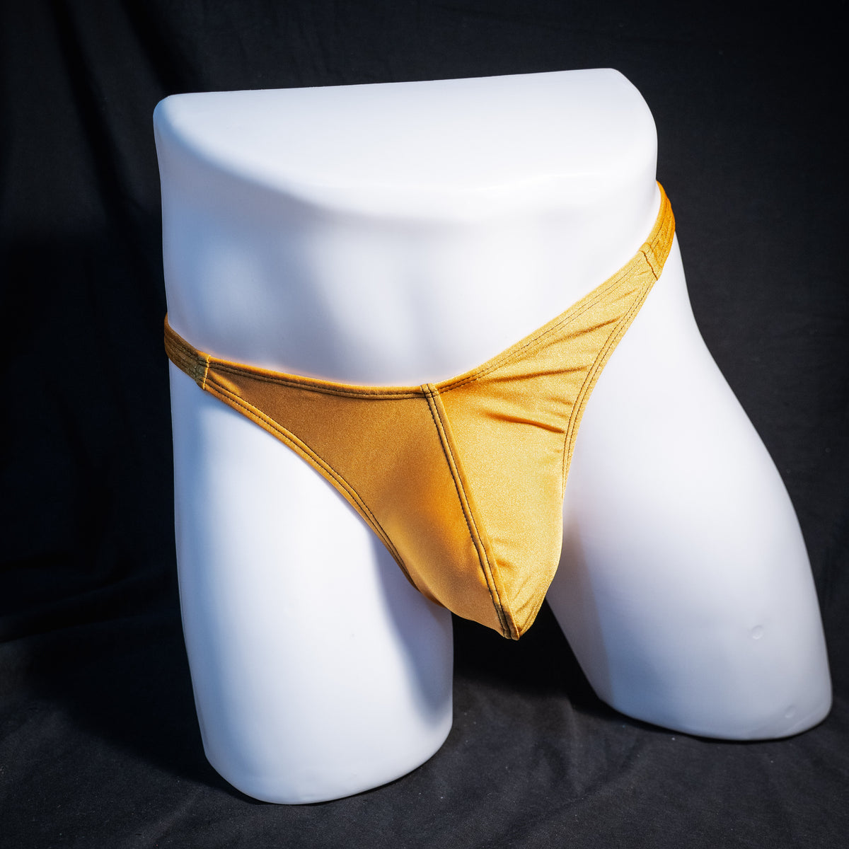 Men's copper spandex thong underwear, classic cut, front view.