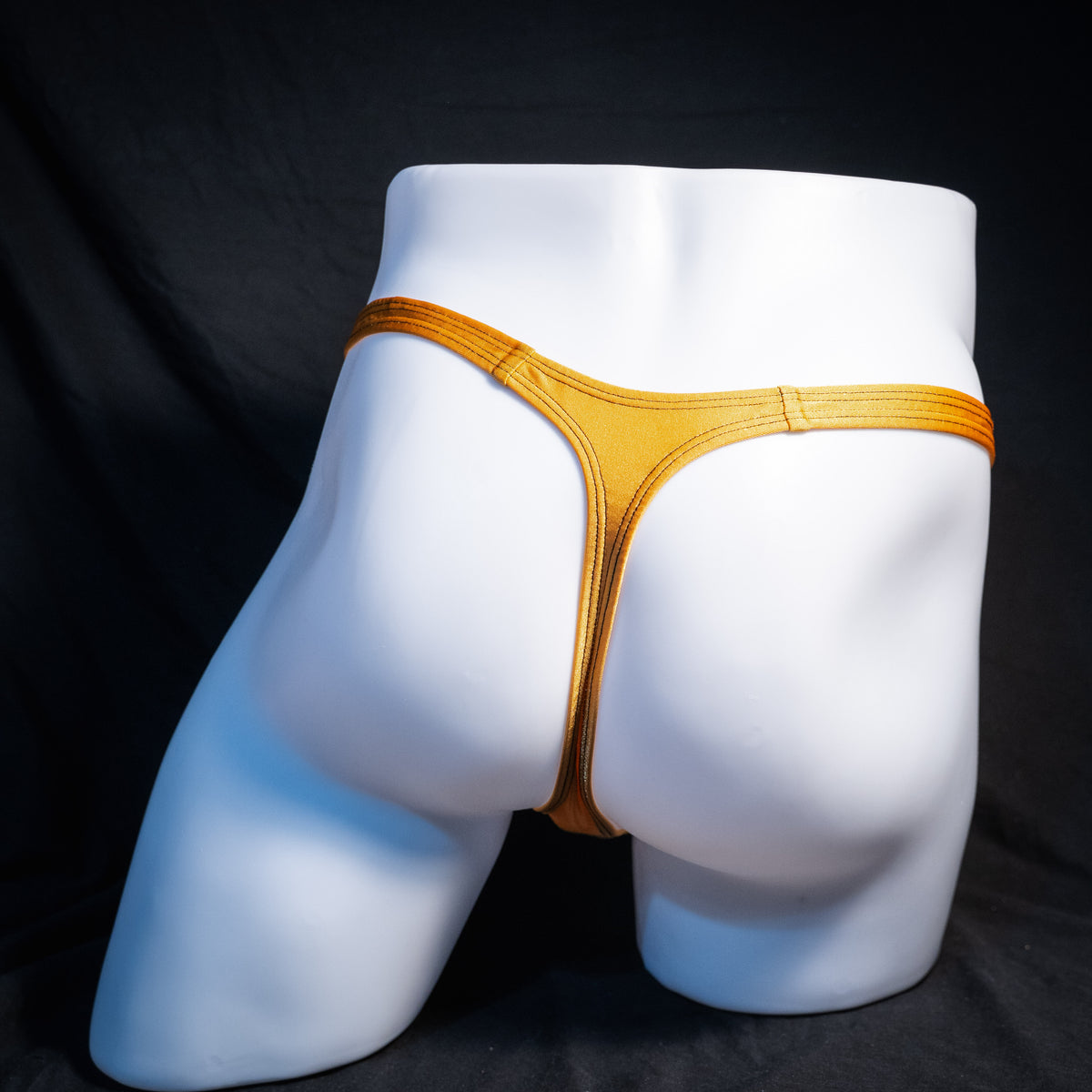 Men's copper spandex thong underwear, classic cut, rear view.