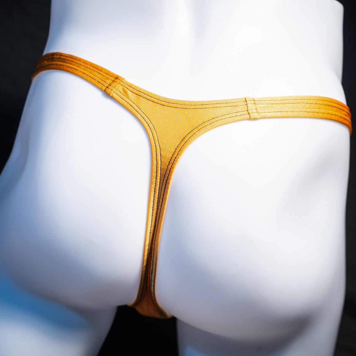 Men's copper spandex thong underwear, classic cut, rear view.