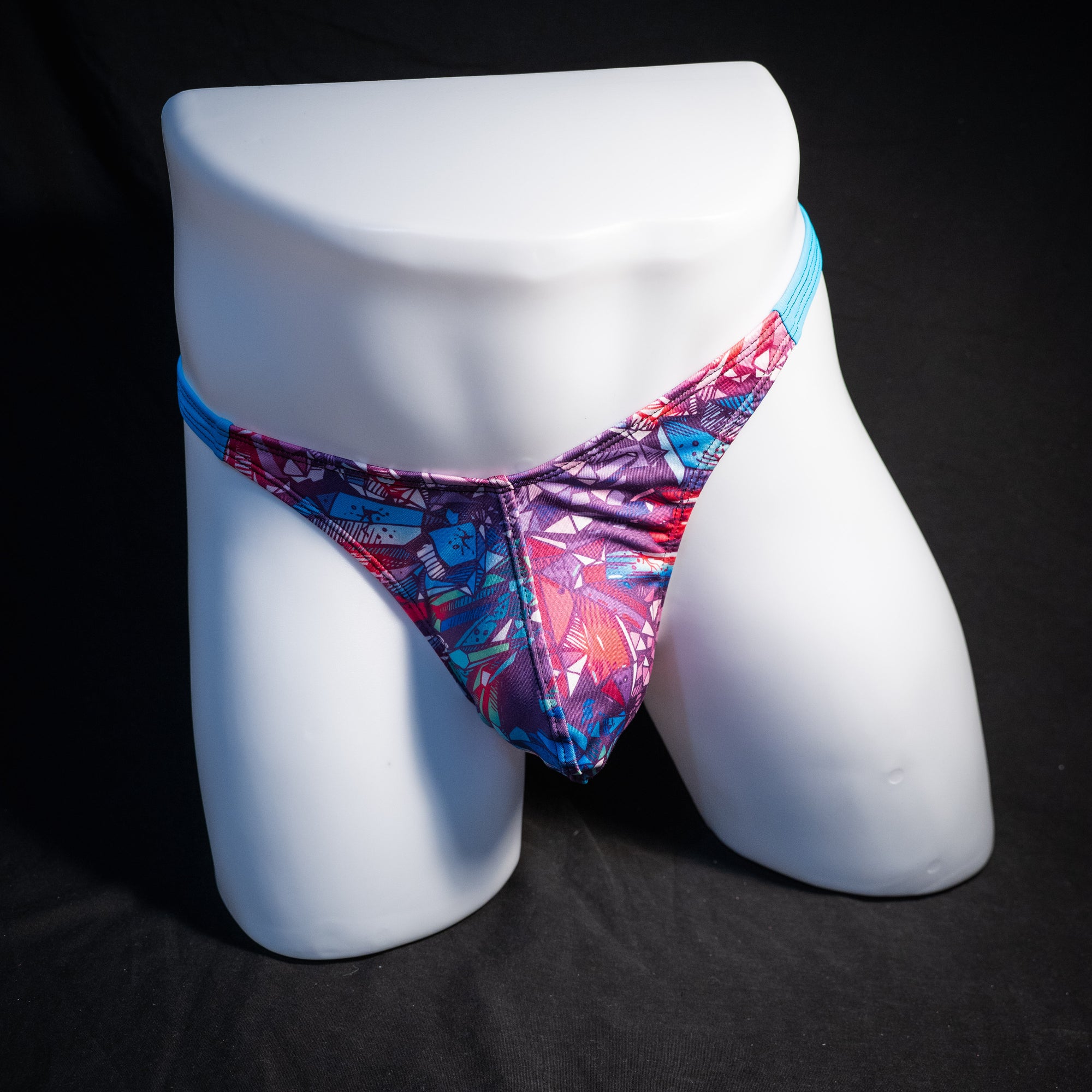 Men's bright crystal thong underwear, classic cut, front view.