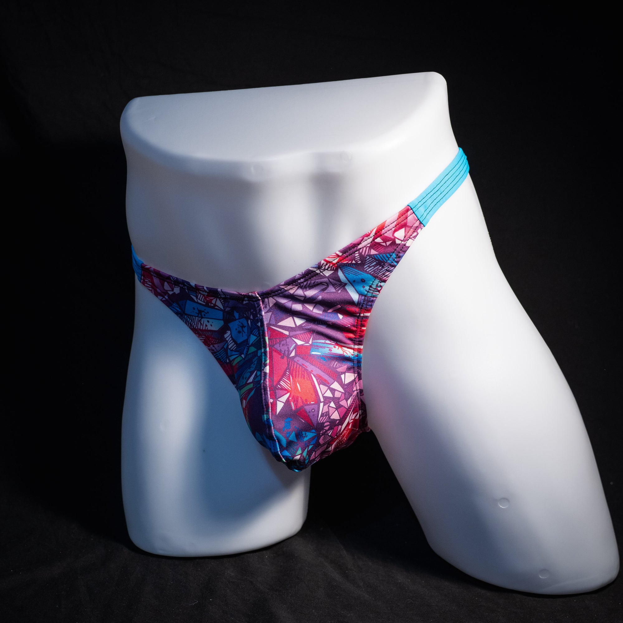 Men's bright crystal thong underwear, classic cut, front view.