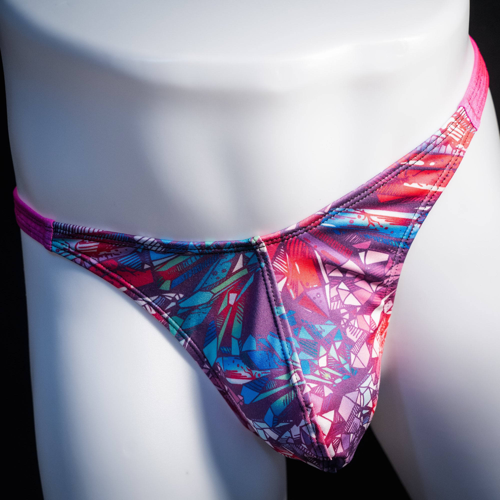 Men's crystal shard thong underwear with pink straps, classic cut, front view.